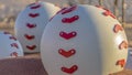 Panorama frame Close up of huge red and white baseball decoration at a park