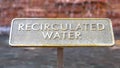 Panorama frame Close up of metal plate with words Recirculated Water embossed on surface Royalty Free Stock Photo