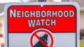 Panorama frame Close up of a Neighborhood Watch sign against a blurred background Royalty Free Stock Photo