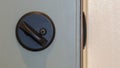 Panorama frame Close up of unlocked deadbolt latch on home door