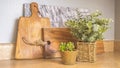 Panorama frame Close up of wooden cutting boards and potted plants inside the kitchen of a home