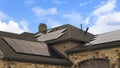 Panorama frame Cloudy blue sky over a home with solar panels on the pitched roof Royalty Free Stock Photo