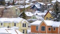 Panorama frame Colorful home cabins with snowy roofs in snow covered Park City Utah in winter Royalty Free Stock Photo