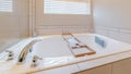 Panorama frame Contemporary spa bath with wooden tray caddy