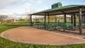 Panorama frame Covered picnic area on a scenic park under cloudy blue sky Royalty Free Stock Photo