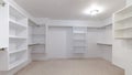 Panorama frame Empty white shelves in a fitted walk-in wardrobe Royalty Free Stock Photo