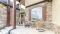 Panorama frame Exterior patio with two wicker comfy chairs Royalty Free Stock Photo