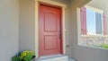 Panorama frame Facade of home with red front door and wooden shutters on the sliding window