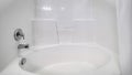 Panorama frame Fitted white oval bath in a compact bathroom Royalty Free Stock Photo