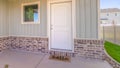 Panorama frame Front door and porch of home with welcome mat Royalty Free Stock Photo