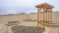 Panorama frame Heart shaped planting beds and wooden arbor at the yard of a home Royalty Free Stock Photo