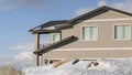 Panorama frame Home against cloudy blue sky at the snowy neighborhood of Wasatch Mountain