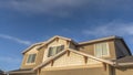 Panorama frame Home with front gable roof and dormers against vast blue sky with clouds Royalty Free Stock Photo