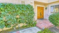 Panorama frame Home with pathway shaped with concrete and bricks leading to the front door Royalty Free Stock Photo