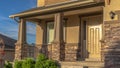 Panorama frame Home with stairs leading to the front door and porch against hill and sky view Royalty Free Stock Photo