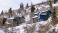 Panorama frame Homes on residential mountain neighborhood in snowy Park City Utah in winter Royalty Free Stock Photo