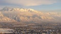 Panorama frame Houses beneath scenic Mount Timpanogos with cloudy blue sky overhead in winter