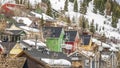 Panorama frame Houses with colorful walls built on a mountain covered with snow in winter