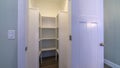 Panorama frame Looking into empty interior of a walk-in closet Royalty Free Stock Photo