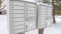 Panorama frame Mailbox against neighbourhood landscape covered with fresh white snow in winter