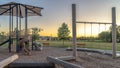 Panorama frame Neighborhood park with fun playground featuring slides and swings for children Royalty Free Stock Photo