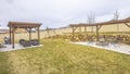 Panorama frame Outdoor living spaces and playground at the spacious and grassy yard of a home