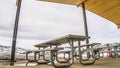 Panorama frame Pavilion with tables and benches under the wooden ceiling at a park in winter Royalty Free Stock Photo