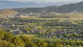 Panorama frame Residential area on a valley with view of distant mountain and cloudy blue sky Royalty Free Stock Photo