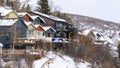 Panorama frame Residential houses on snowy mountain slope in scenic Park City Utah in winter Royalty Free Stock Photo