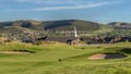 Panorama frame Sand trap and fairway at a golf course with mountain and homes in the background Royalty Free Stock Photo