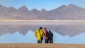 Panorama frame Three tourists in Bonneville Salt Flats, Utah, USA