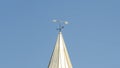 Panorama frame White tower and weather vane at the roof of a barn at a vinyard against blue sky Royalty Free Stock Photo