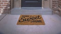 Panorama frame Wreath and doormat on the front door with sidelights and transom window