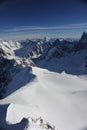 Panorama of French Alps with mountain ranges covered in snow in winter Royalty Free Stock Photo