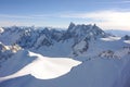 Panorama of French Alps with mountain ranges covered in snow in winter Royalty Free Stock Photo