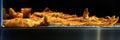 Panorama of fried battered fish in a warming oven at a fish and chip shop Royalty Free Stock Photo
