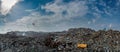 Panorama of the garbage dump full of litter, plastic bottles and other trash at the Thilafushi island