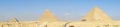 Giza pyramids in Cairo, Egypt. General view of pyramids from the Giza Plateau pyramids known as Queens\' Pyramids on front side. Royalty Free Stock Photo