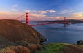 Panorama of the Golden Gate bridge with the Marin Headlands and San Francisco skyline at colorful sunset, California Royalty Free Stock Photo