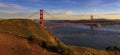 Panorama of the Golden Gate bridge with the Marin Headlands and San Francisco skyline at colorful sunset, California Royalty Free Stock Photo