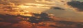 Panorama of Golden hour orange sky with clouds and the yellow sun shining nature background sunrise or sunset scene Royalty Free Stock Photo