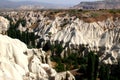 The gorge and rocks of the White Valley of Baglidere with rocks of Rose Valley in the background in Cappadocia, Turkey