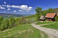 Panorama of grassland and forest in Beskid Sadecki mountains Royalty Free Stock Photo