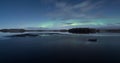 Panorama of half frozen lake at winter night with aurora Royalty Free Stock Photo