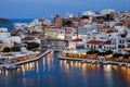 A panorama of the harbor city of Agios Nikolaos. View of the night sea, interesting landscapes, colorful houses, a coast view from