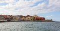 A panorama of the harbor city of Chania. View of the emarald sea, interesting landscapes, colorful houses, a coastline. Greece. Royalty Free Stock Photo