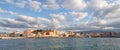 A panorama of the harbor city of Chania. View of the emarald sea, interesting landscapes, colorful houses, a coastline. Royalty Free Stock Photo