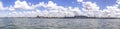 Panorama of heavy harbor jib cranes and ships on the pier in the Klaipeda Sea Port Royalty Free Stock Photo