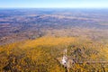 Panorama from height to autumn forest and trees. Flying over the forest on bright sunny autumn day. Flight over the mountains