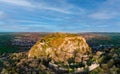 Panorama of a hill with the ruins of the Hohentwil castle on its top against a blue sky Royalty Free Stock Photo
